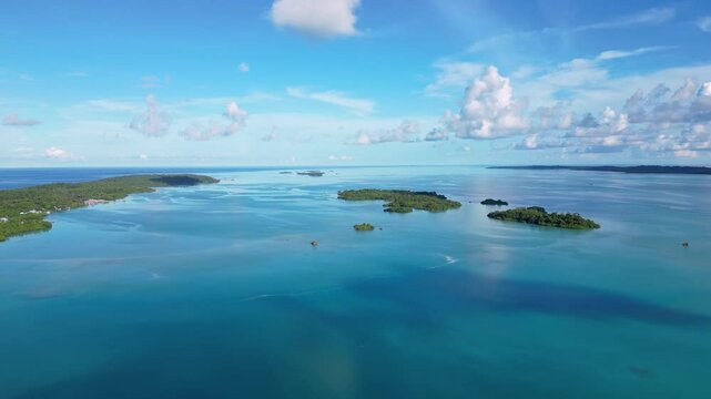 Maratua, Indonesia: Aerial drone footage of island inside the Maratua turquoise lagoon in the Derawan archipelago in Kalimantan in Indonesian Borneo. 