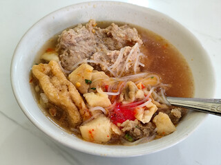 Bakso, Meatballs are served in white bowls, equipped with various toppings, they look delicious and delicious, at roadside stalls.