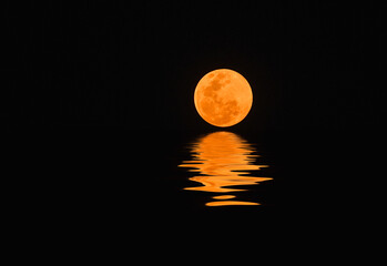 Full moon over a dark sky.