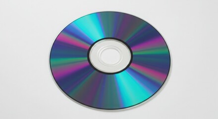Shiny compact disc isolated on white background reflecting light in a colorful spectrum 