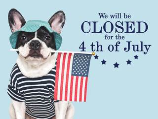 Signboard with the inscription We will be closed for the 4th of July. Cute puppy. Closeup, indoors. Studio shot. Congratulations for family, loved ones, friends and colleagues. Pets care concept