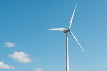 Innovative Wind Turbine Against a Clear Blue Sky with White Clouds, Symbolizing Renewable Energy and Sustainable Technology for Future Generations
