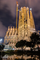 The illuminated Nativity Faade of the famous Sagrada Familia in Barcelona at night