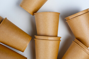 Brown paper cups on white background.
