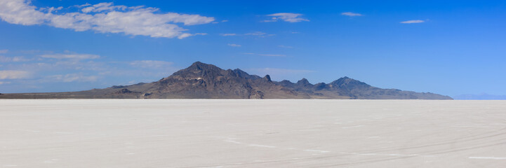Scenic panoramic view of Bonneville salt flats in Utah during sunny summer day.