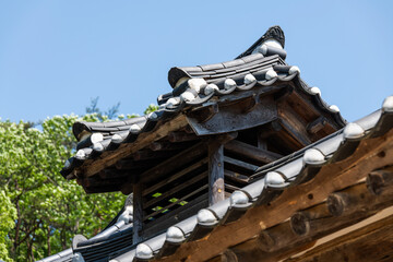 old wooden eaves of the traditional Korean building in the Buddhist temple