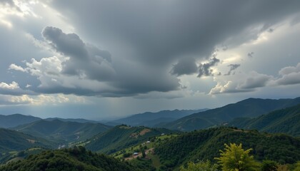 Obraz premium Panoramic green mountain landscape with summer clouds, forest, and sky view