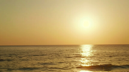 Obraz premium Golden Sunset Over Ocean Horizon, Gentle Waves, Minimalist Seascape with Copy Space, Tranquil Coastal Background, Empty Sky and Water, Serene Nature Scene