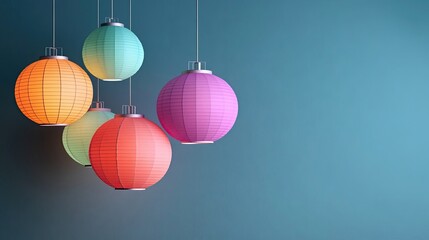 Colorful paper lanterns hanging against a blue wall creating a festive and modern atmosphere in the room