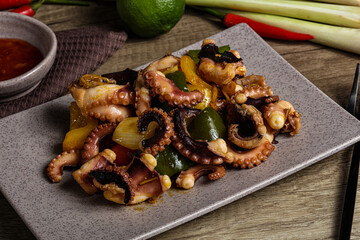 Roasted octopus with vegetables and oil