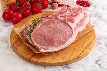 Raw potk loin steak with bone