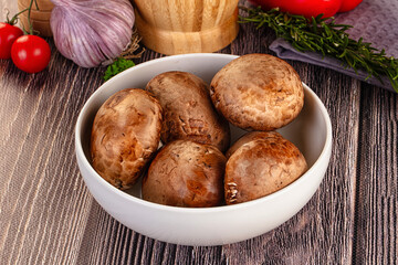 Raw brown champignon heap for cooking