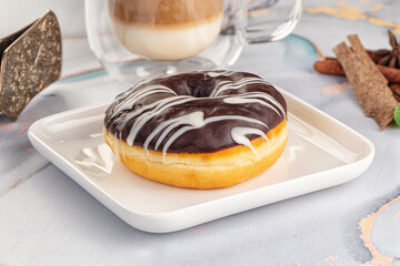Delicous sweet donut with chocolate glaze
