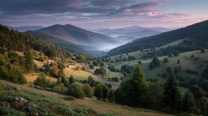 Fototapeta premium Serene mountain landscape at sunrise with warm atmospheric light and tranquil scenery in early morning nature