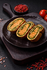 Roll of omelette, spinach, cheese and minced meat