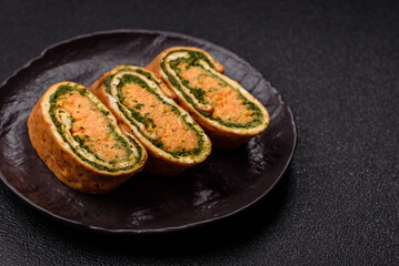 Roll of omelette, spinach, cheese and minced meat
