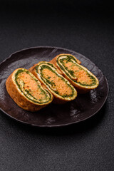 Roll of omelette, spinach, cheese and minced meat