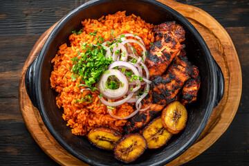 nigerian jollof rice with chicken and plantains top view