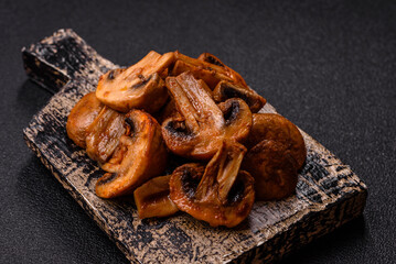 Food, baked mushrooms champignon slices with sauce and spices