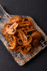 Food, baked mushrooms champignon slices with sauce and spices