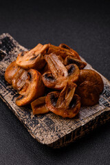 Food, baked mushrooms champignon slices with sauce and spices