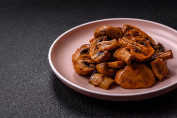 Food, baked mushrooms champignon slices with sauce and spices