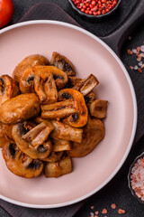 Food, baked mushrooms champignon slices with sauce and spices