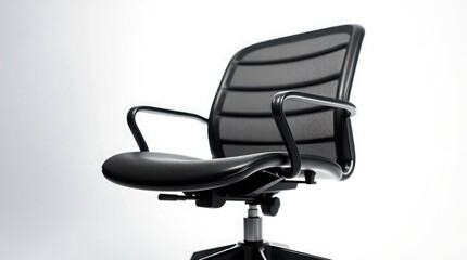 Fototapeta premium A low angle shot of a black office chair with mesh back against a white background in a studio setting