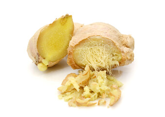 Close-up of ginger slices over white background,