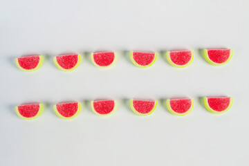 Fruit jelly mixed with sugar on white background