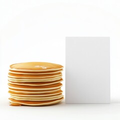 Obraz premium A stack of pancakes sits next to a white card