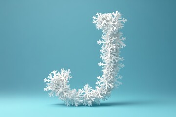 Obraz premium The letter J is made of snowflakes and is on a blue background