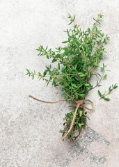 Fresh thyme herbs on rustic surface
