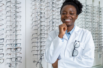 Pretty young smiling female doctor in optical shop