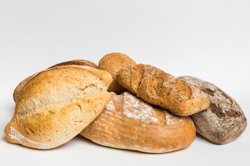 Homemade natural breads. Different kinds of fresh bread as background, perspective view with copy space