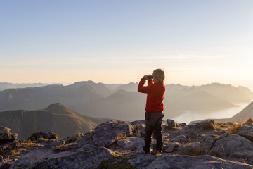 Children and adults, family with dog, hiking Grytetippen trail in Senja, Lofoten on a sunny hot summer day