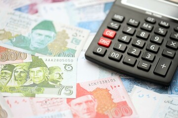 Pakistan rupees banknotes and calculator. The current Pakistan money bills with calculator