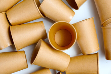 Brown paper cups on white background.