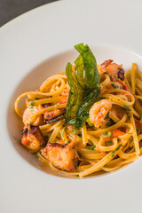 Linguine pasta with shrimp and seafood in tomato and garlic sauce