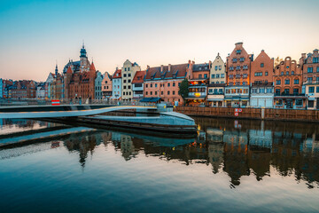 Obraz premium Gdansk with Motlawa river in Poland. Old town colourful house with Holy Spirit Gate