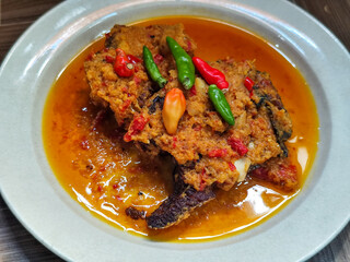 Tilapia with yellow curry, a traditional Indonesian dish, which has a delicious taste, beautifully presented.