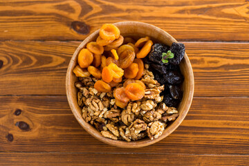 Natural dried Prunes, dried apricots and nuts close-up in macro photography