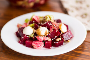 Fresh summer salad with beets and white mozzarella cheese