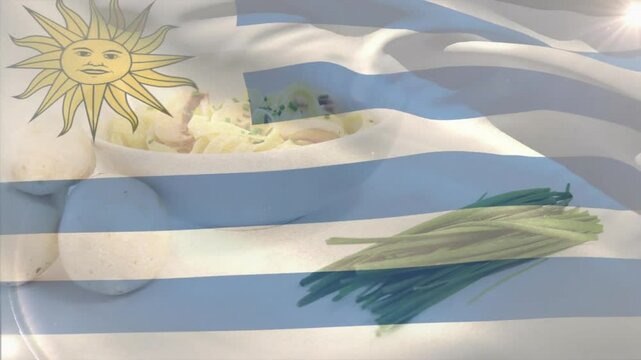 Uruguayan flag beginning drifting over plate featuring eggs with yolk and chives, creating contrast