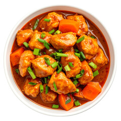 A bowl of flavorful chicken stew with carrots and garnished with chopped green onions