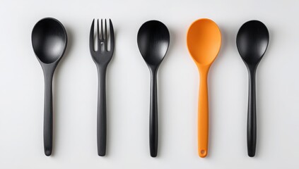 Stylish Black and Orange Kitchen Utensils Spoons and Fork Set on White Background