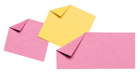 Three overlapping isolated cut out blank pink yellow paper notes cardboard with folded corner dog-ear earmark and copy space for text, transparent png background design element