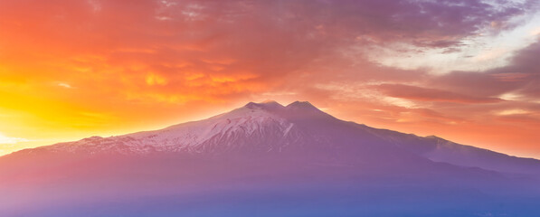 beautiful mountain sunset landcape with great magestic mountains and amazing slopes and canyons with evening clouds. Panorama of vulcano Etna in Sicily, Italy.