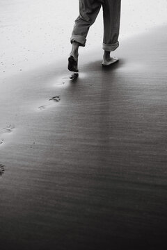 Man's footprints in the sand