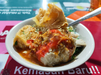 Rib meatball food is served in white bowls, equipped with various toppings, looks delicious and...